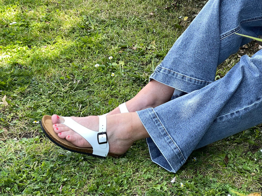 Quality European women's sandals. Made in Spain contoured cork footbed and rubber sole. Thong style sandal that comes in white.