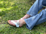 Quality European women's sandals. Made in Spain contoured cork footbed and rubber sole. Thong style sandal that comes in white.