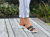 Comfortable women's slide  sandals. European from Spain. Soft quality leather straps and wedge sole unit. In black.