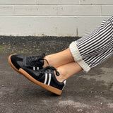 Comfortable sneakers, soft leather rubber sole unit. Great women's shoes for everyday wear in black white stripes.