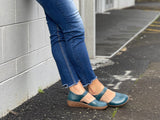 Smart denim blue sandal in soft leather uppers. Velcro strap, wedge sole unit. Comfortable women's sandal. Women's shoes with cushioned footbed.