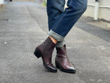 Burgundy western style ankle boots with a high shine, textured leather finish, zipper entry. Robust rubberized sole. European handmade in Portugal with quality leathers beautiful women's boots.